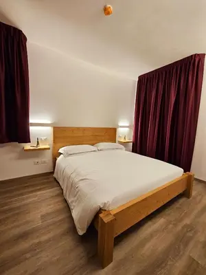 Letto o letti in una camera di Casa Nostra