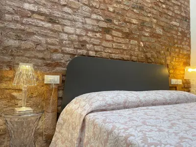 Letto o letti in una camera di Residenza Casanova, appartamento in Giudecca