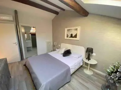 Letto o letti in una camera di Residenza Casanova, appartamento in Giudecca