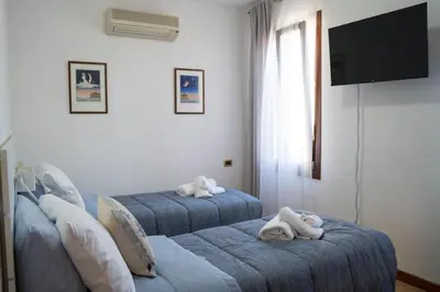 Letto o letti in una camera di All’Altana b&b apartment