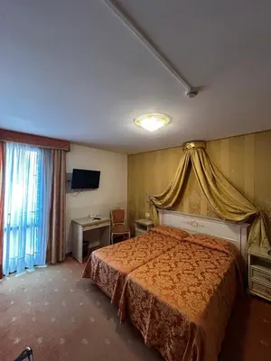 Letto o letti in una camera di Ambassador Tre Rose