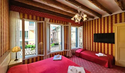Letto o letti in una camera di Hotel Messner