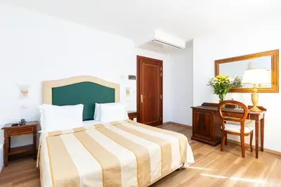 Letto o letti in una camera di Hotel Giardinetto Venezia