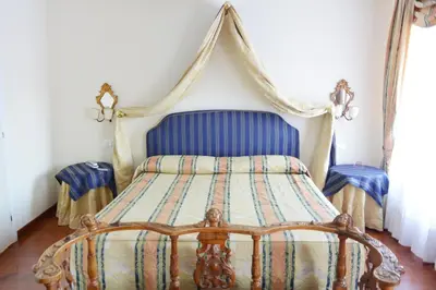 Letto o letti in una camera di Hotel San Zulian
