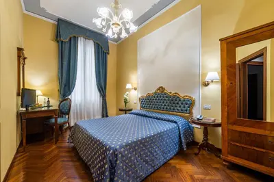 Letto o letti in una camera di Locanda Sant'Agostin