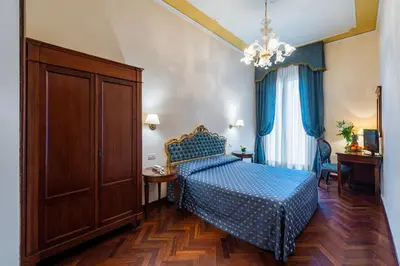 Letto o letti in una camera di Locanda Sant'Agostin