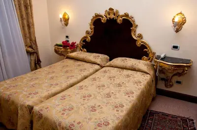 Letto o letti in una camera di Residenza d'Epoca San Cassiano