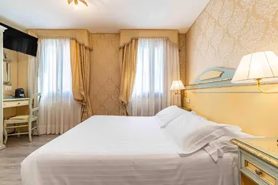 Letto o letti in una camera di Hotel Falier
