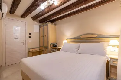 Letto o letti in una camera di Hotel Falier