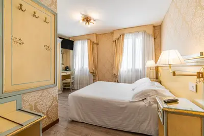 Letto o letti in una camera di Hotel Falier