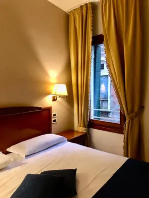 Letto o letti in una camera di Locanda del Ghetto