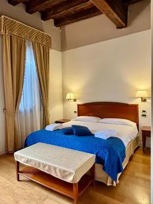 Letto o letti in una camera di Locanda del Ghetto