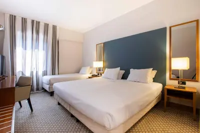 Letto o letti in una camera di Belstay Venezia Mestre