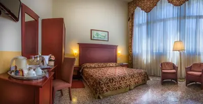 Letto o letti in una camera di Palazzo Marcello Hotel Al Sole