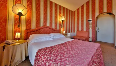 Letto o letti in una camera di Hotel Biasutti