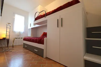 Letto o letti in una camera di Casa al Piave - appartamento a 5 km dal mare