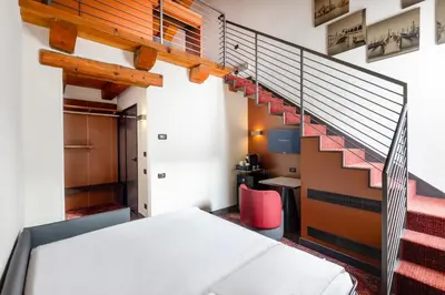 Letto o letti in una camera di Eurostars Residenza Cannaregio