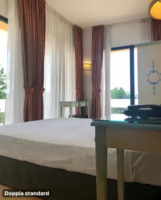 Letto o letti in una camera di Hotel Ariston