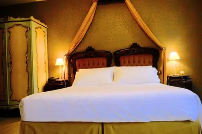 Letto o letti in una camera di ll H O T E L S A N G A L L O ll