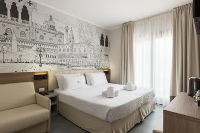 Letto o letti in una camera di Hotel Marco Polo 3 Stelle Superior