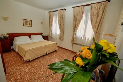 Letto o letti in una camera di Hotel Riviera dei Dogi