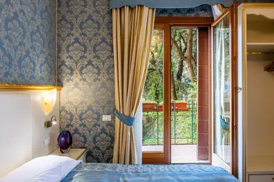 Letto o letti in una camera di Hotel Il Mercante di Venezia