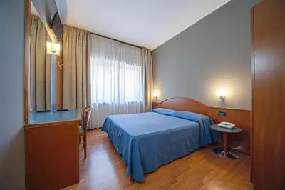 Letto o letti in una camera di Hotel Centrale