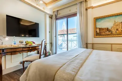 Letto o letti in una camera di Monaco & Grand Canal