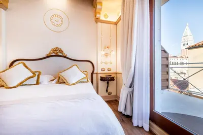 Letto o letti in una camera di Monaco & Grand Canal