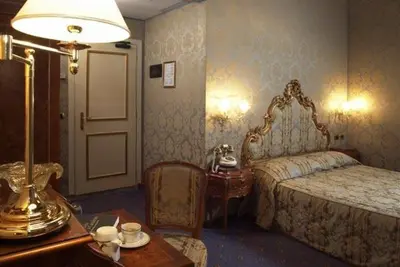 Letto o letti in una camera di Al Ponte Antico