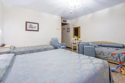 Letto o letti in una camera di Hotel Mercurio