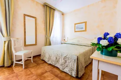 Letto o letti in una camera di Hotel Mercurio