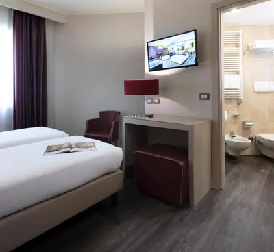 Letto o letti in una camera di Smart Hotel Holiday