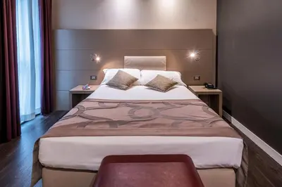 Letto o letti in una camera di Smart Hotel Holiday