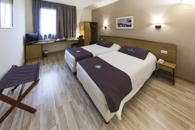 Letto o letti in una camera di Tulip Inn Padova