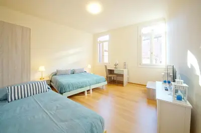 Letto o letti in una camera di Ca' Circus 4 Rooms WI-FI Fibre
