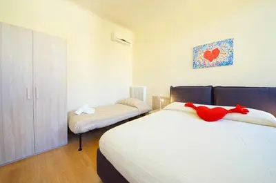 Letto o letti in una camera di Ca' Circus 4 Rooms WI-FI Fibre