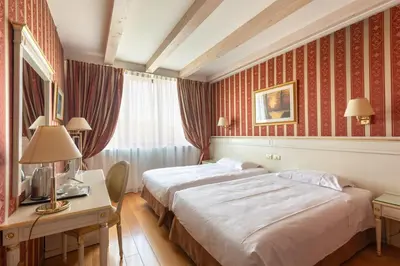 Letto o letti in una camera di Noventa Hotel