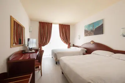 Letto o letti in una camera di Noventa Hotel
