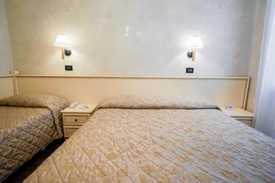 Letto o letti in una camera di Hotel Carlton Capri
