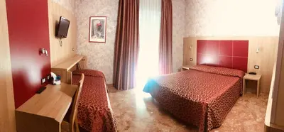 Letto o letti in una camera di Hotel San Carlo
