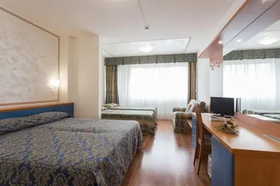 Letto o letti in una camera di Hotel Airmotel