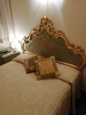 Letto o letti in una camera di Hotel Al Ponte Mocenigo