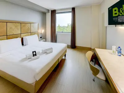 Letto o letti in una camera di B&B HOTEL Padova