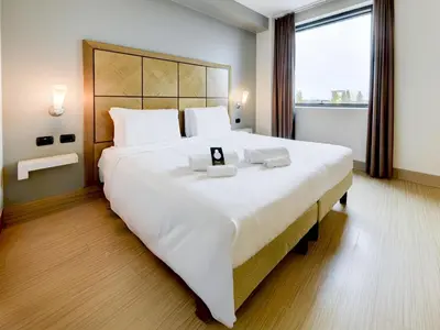 Letto o letti in una camera di B&B HOTEL Padova