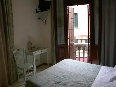 Letto o letti in una camera di Hotel Adua