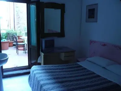 Letto o letti in una camera di Hotel Adua