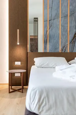 Letto o letti in una camera di Hotel Terme Milano