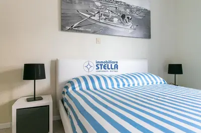 Letto o letti in una camera di Condominio Secchiati