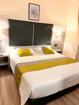 Letto o letti in una camera di Hotel Aurora
